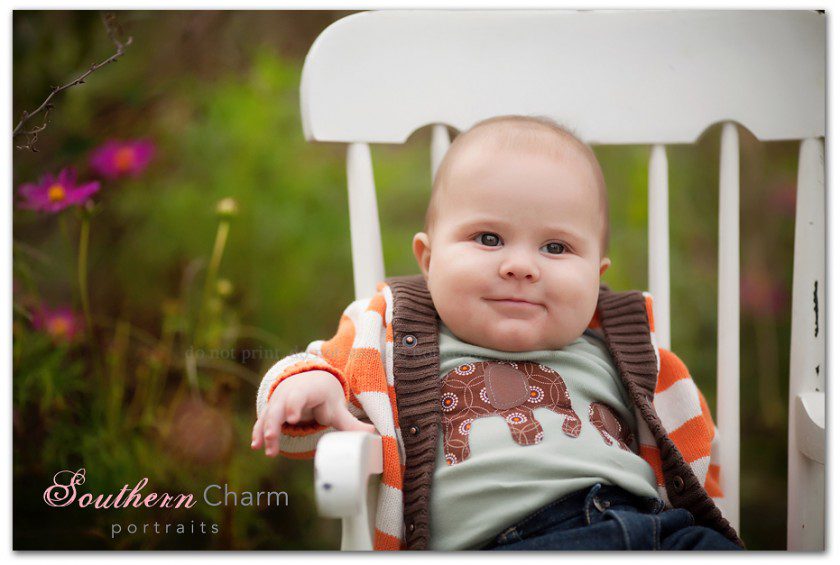 baby in white rocking chair at ut gardens in knoxville tennessee photographers