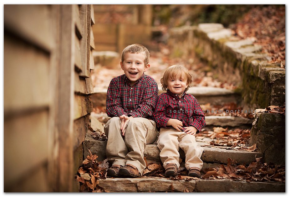 brothers on steps at norris dam grist mill area perfect location for fall pictures