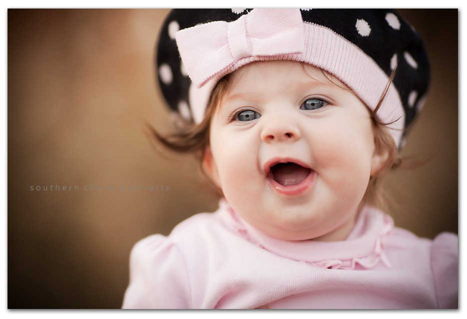 6 month old babies have so many cute expressions love the polka dotted sweater hat she is wearing