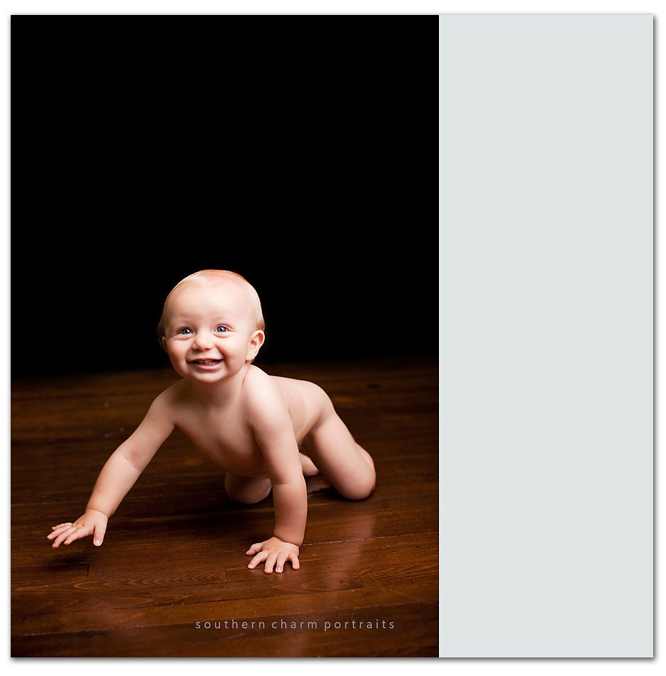 naked baby in studio crawling