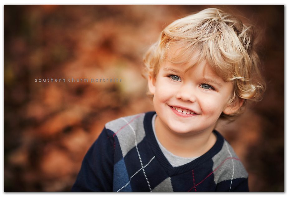 cute blonded headed boy with curls and blue eyes