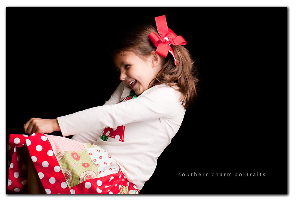 image of little girl leaning back and laughing