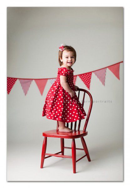 red and white bunting banner hanging in background dots stripes