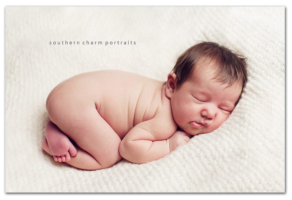 little wrinkles of chubby newborn sleeping infant