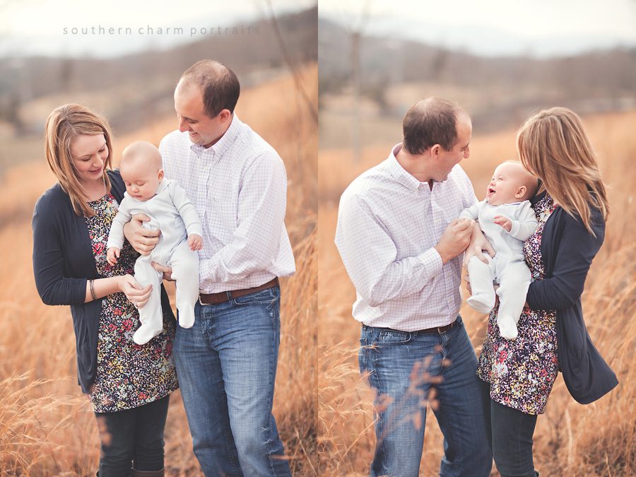 laughs and good times with baby and mom and dad in field for family portraits