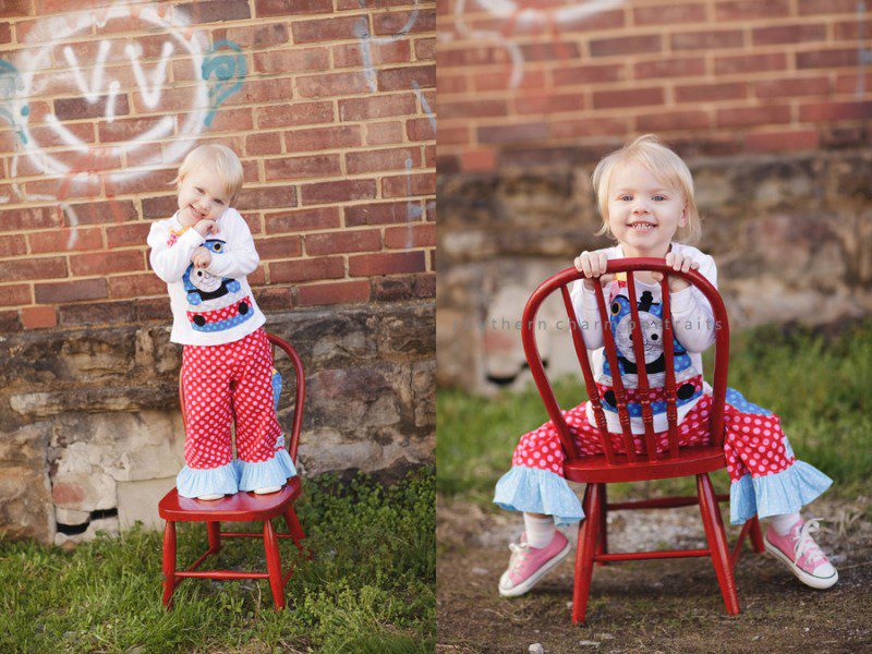 little girl in red chair in downtown lafollette wearing polkadaisies clothing