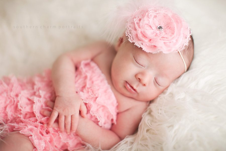baby in lacey pettiromper and coordinating headband