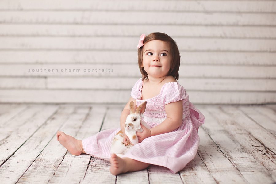 little girl holding bunny