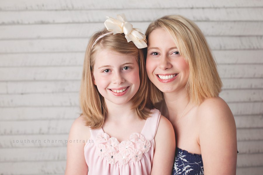 sisters in portrait studio for easter pictures