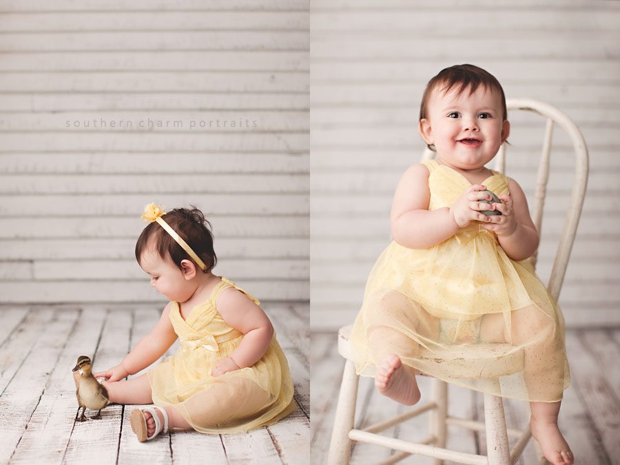 baby holding easter egg and sitting in antique chair