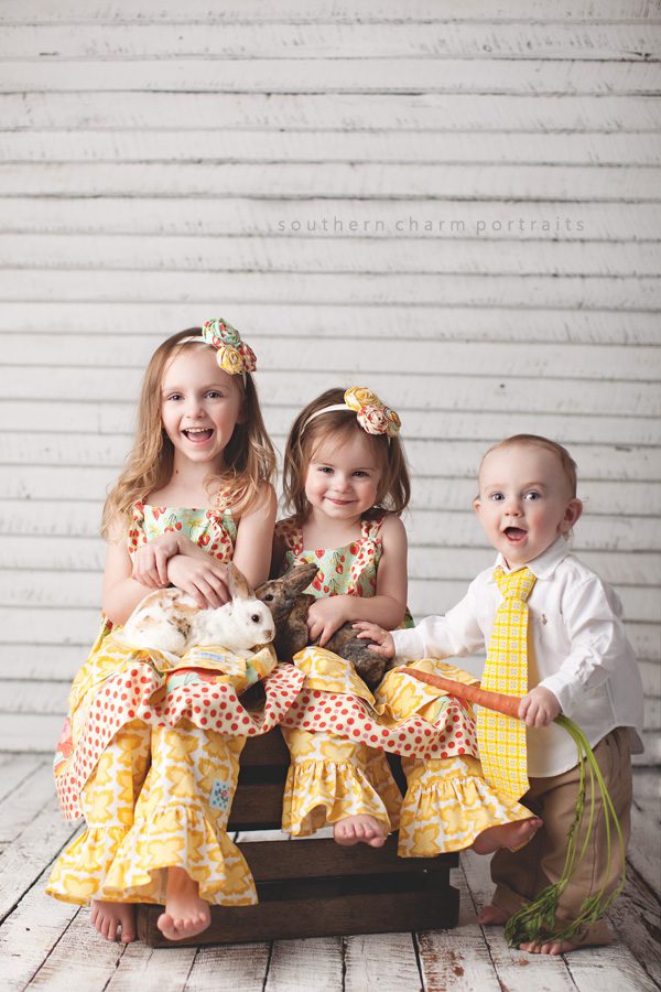 three young children in portrait studio for easter pictures