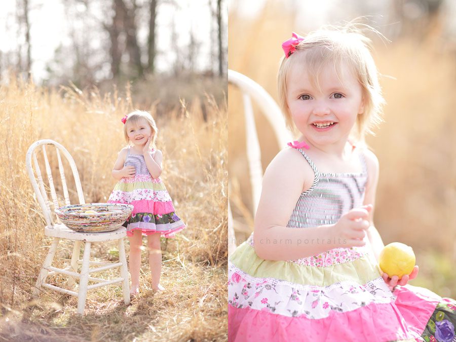 little girl in field with lemons