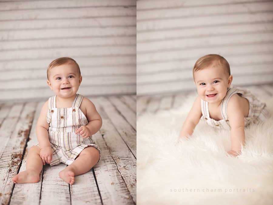 little guy in overalls smiling and crawling in portrait studio