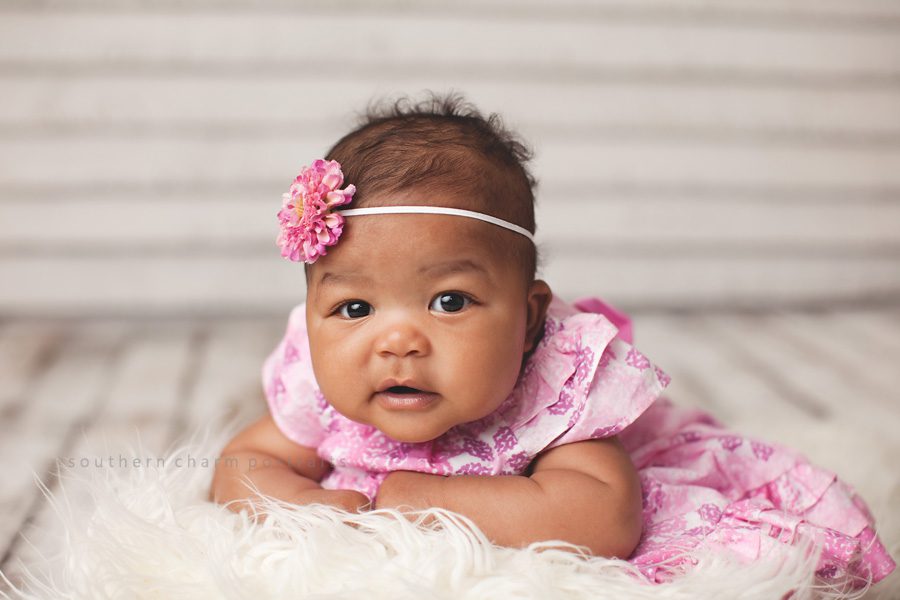 baby with pink dress and headband