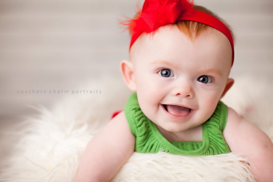 baby girl with watermelon dress and red headband