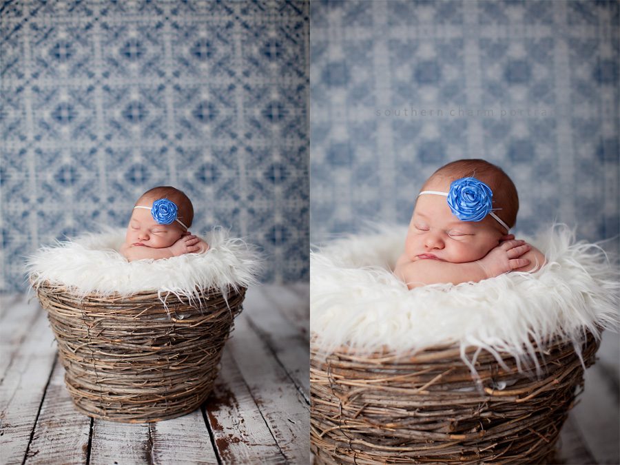 baby sleeping in wicker basket with blue flower headband