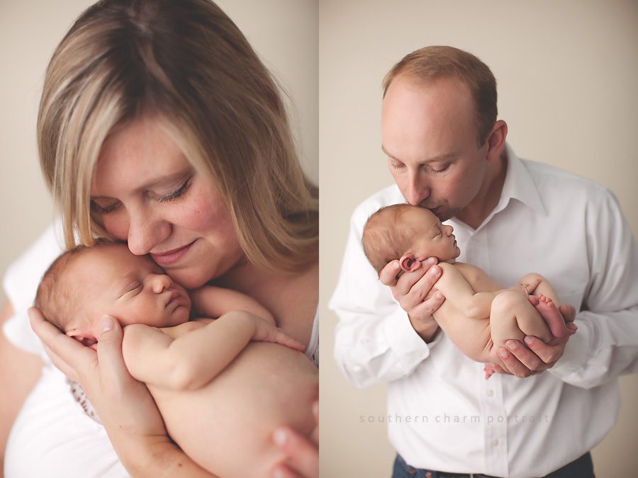 mom and dad holding sweet infant in first picture session