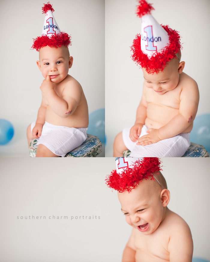 baby in first birthday hat being photographed by Knoxville Baby Photographer 