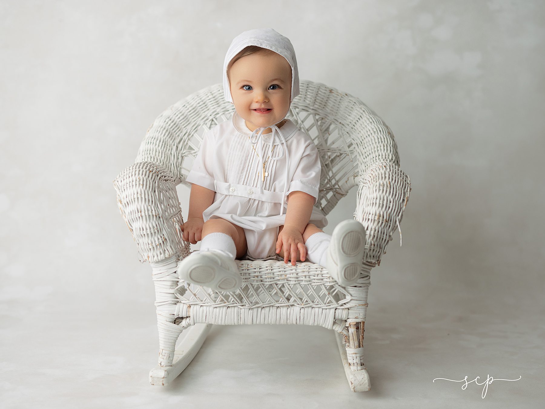 baby in christening gown